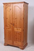 A modern good quality pine wardrobe havi