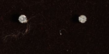 A pair of white gold diamond stud earrin