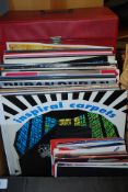 A collection of vinyl LP records featuri