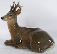 A ROYAL COPENHAGEN PORCELAIN FIGURE OF A