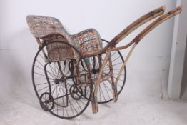 A Victorian bamboo and rattan upholstere