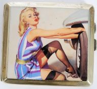 A silver plated engine turned cigarette