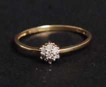 A 9ct gold diamond daisy ring