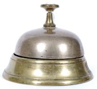 A vintage shop counter top brass attenti