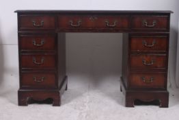 A Georgian style mahogany twin pedestal
