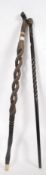 2 carved African tribal walking sticks,