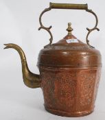 A large Victorian embossed copper kettle