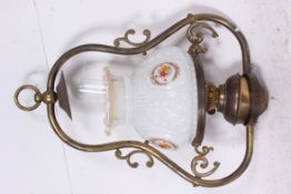 A Victorian brass hanging oil lamp with