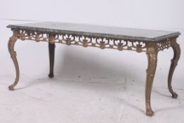 A 20th century gilt metal and veined mar