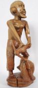 A large carved wooden tribal figurine of