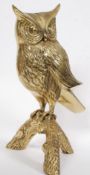 A 20th century large brass owl raised on