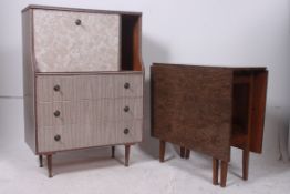 A 1950's bureau desk having unusual grey