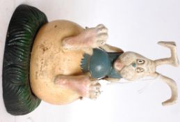 A 20th century cast iron moneybox in the