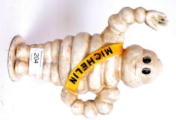 A vintage style cast iron Michelin Man s
