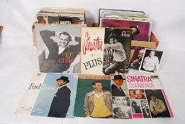 A collection of 100x Frank Sinatra vinyl record LP albums.