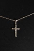 A ladies silver 925 crucifix and chain. THe crucifix being chase decorated. Weight 5.4g