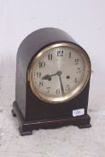 An early 20th century English dome cased bracket mantle clock having an eight day movement set