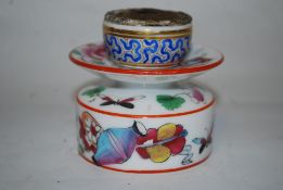 A 19th century Chinese famille rose ceramic oil burner. The base decorated with carp, amphora and