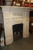 A pair of Victorian cast iron painted fireplaces having reeded column sides and mantels atop to