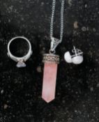 A silver and CZ dress ring together with a rose quartz pendant necklace and a pair of ball earrings