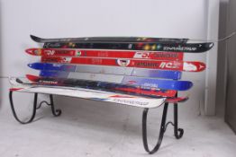 An unusual large garden / reception bench settle constructed of 20th century ski's of various