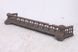 A 19th century cast iron fret pierced fire fender / kerb having pierced design with ebonised finish.