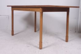 A walnut veneer 1930's Dinette retro dining table raised on turned column legs having fitted