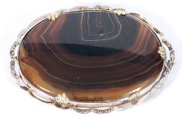A yellow metal believed gold mounted ladies stone brooch.