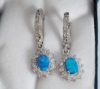 A pair of silver, opalite and CZ earrings