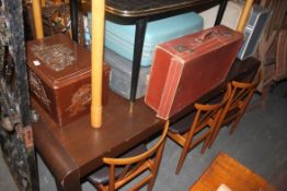 A large contemporary John Lewis style oak dining table raised on squared supports with shaped ends