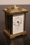 A 20th century Rapport of London brass carriage clock. The open escapement with glass viewing