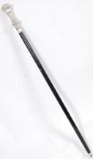 An ebonised walking stick cane with silver plated top.