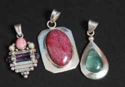 Three silver 925 ladies necklace pendants with pink and green stones mounted to decorative silver