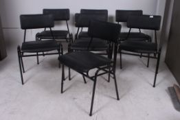 A set of 7 vintage 1960's metal tubular stacking chairs having padded seats and back rests by