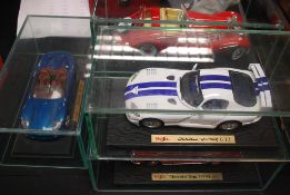 A collection of 5x Maisto 1:18 scale diecast cars, each within a glass display box.
