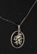A ladies silver 925 necklace and pendant. The silver chain with oval pendant  being fret pierced