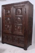 An 18th century carved oak Breton wardrobe armoire. Of immensely thick oak construction with