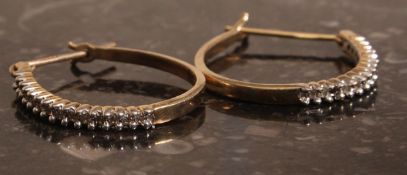 A pair of 9k gold diamond earrings. Weight 2,1g.