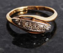 An 18ct gold and 5 stone diamond ring being suspension set with 5 diamonds approx 0.05cts to the