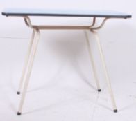 A retro tubular metal and formica dining