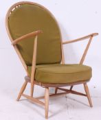 An Ercol beech and elm wood light tall b