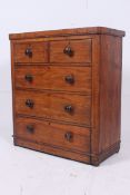 A two over three chest of drawers standi