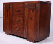 A 1930's art deco oak sideboard having a