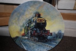 A large collection of collectors plates