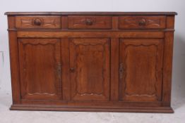 A 19th century French oak sideboard dres