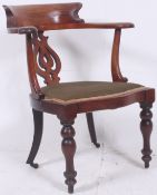 A Victorian mahogany desk chair with tur