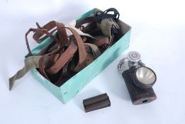 A collection of military belts, straps a