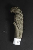 A bone walking stick handle in the form