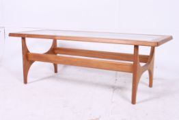 A 1970's retro teak lozenge shaped coffe