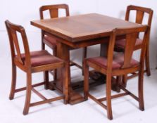 A 1930's Art Deco oak draw leaf refector